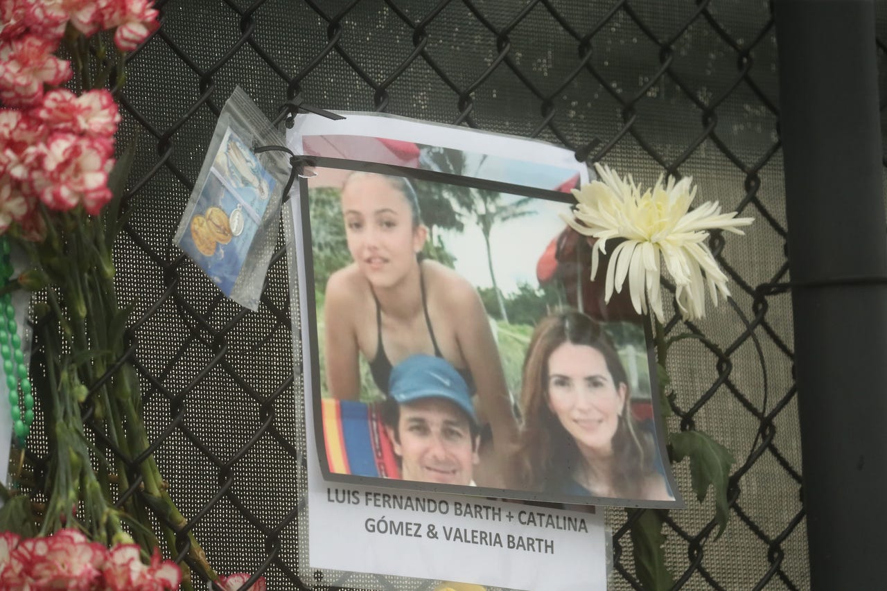 Shown is Luis Fernando Barth, Catalina Gomez and Valeria Barth. Posters of some of the people missing from the Champlain Towers south condo collapse in Surfside, Florida, were photographed on Monday, June 28, 2021 at the memorial fence near the scene.