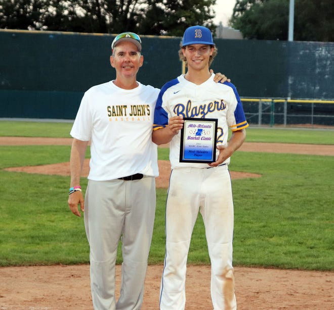 Clear Spring’s Eric Bender, right, poses for a photo with National all-star team coach Omar Enriquez after being named MVP of the Mid-Atlantic Baseball Classic’s Elite Game on Monday at Municipal Stadium.