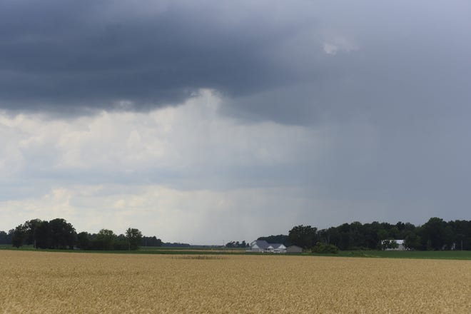Dark rain clouds pass above Bucyrus ahead of Tuesday's thunderstorm.