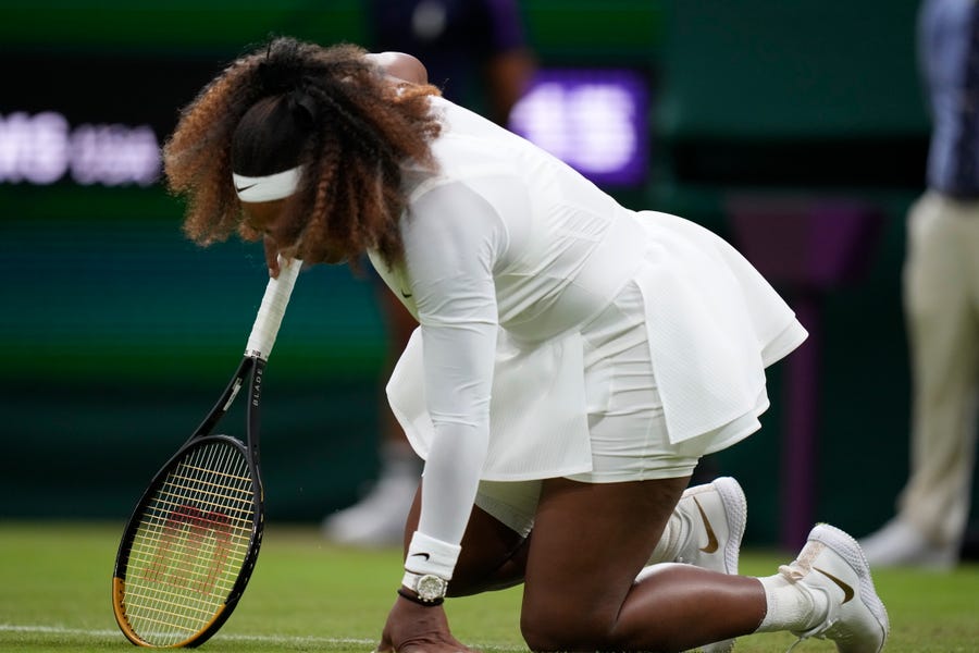 Serena Williams falls to the ground during her first-round match against Aliaksandra Sasnovich of Belarus.