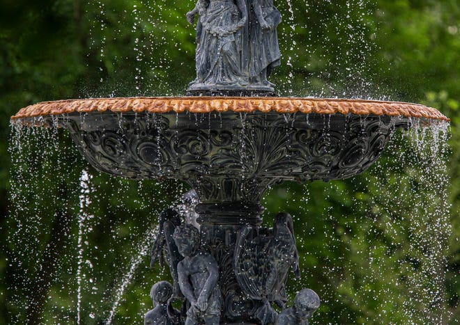 The Studebaker Electric Fountain, which was restored and reinstalled in 2019, suffers from hard water buildup at South Bend's Leeper Park.