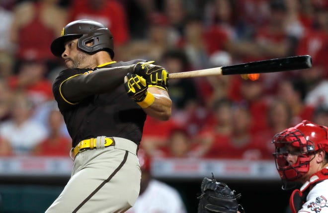 Jun 29, 2021; Cincinnati, Ohio, USA; San Diego Padres left fielder Tommy Pham (28) hits a single against the Cincinnati Reds during the seventh inning at Great American Ball Park. Mandatory Credit: David Kohl-USA TODAY Sports