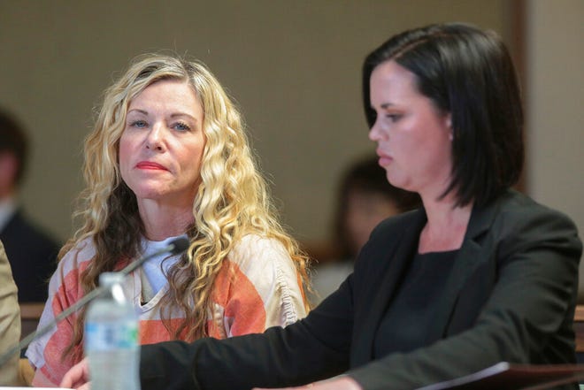 This March 6, 2020, file photo shows Lori Vallow Daybell, left, glancing at the camera during her hearing on in Rexburg, Idaho. Daybell, who is already charged in Idaho with murder conspiracy in the deaths of her daughter and son, was charged in Arizona on Thursday, June 24, 2021, with conspiring to murder her ex-husband Charles Vallow in 2019. (John Roark/The Idaho Post-Register via AP, Pool,File)