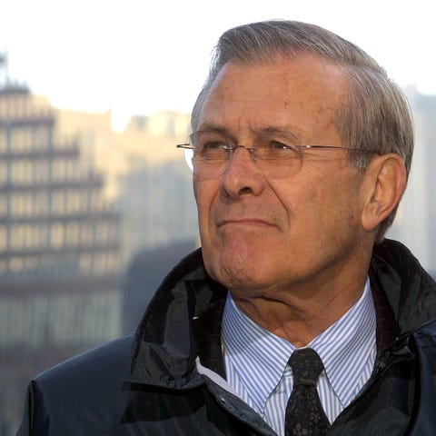 Secretary of Defense Donald Rumsfeld listens to re