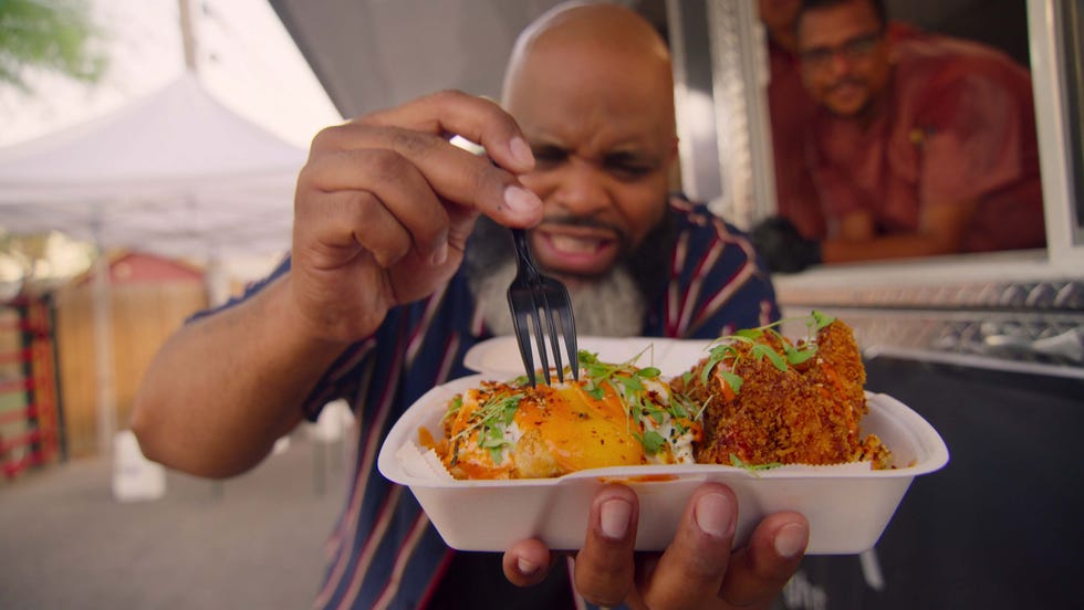 Food critic Daymon Scott “Daym Drops” Patterson tasting the Hakka Street Noddles (pork tonkatsu, shrimp and fried egg) by chef Manny Rivera of Prisma on an episode of "Fresh, Fried and Crispy."