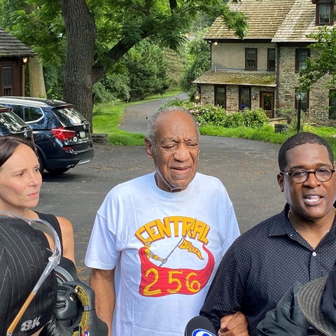 Bill Cosby flanked by his attorney Jennifer Bonjea