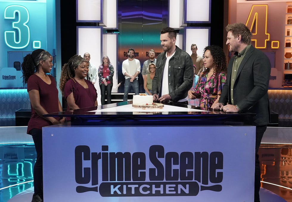 Contestants Amanda and Erinn with host Joel McHale and judges Yolanda Gampp and Curtis Stone in an episdoe of "Crime Scene Kitchen."