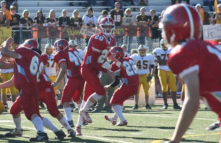 Carson Wentz (20) throws a pass in a high school game with Bismarck Century.