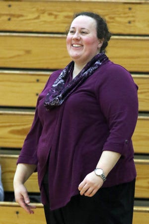 Knox College's Women's Head Coach Emily Cline dons a smile during the game against the Iowa Wesleyan Tigers Monday, December 16, 2019 on Olan G. Ruble Arena in Mount Pleasant.