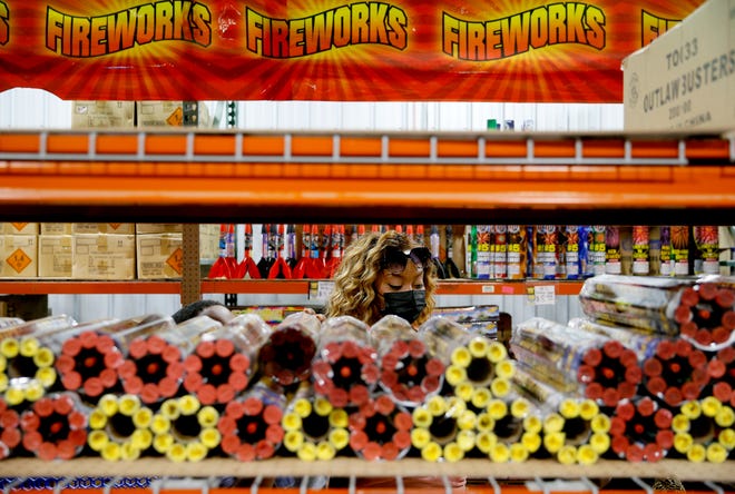 Khatera Johnson shops for fireworks inside Fireworks Outlet OKC in Valley Brook, Thursday, July 1, 2021.