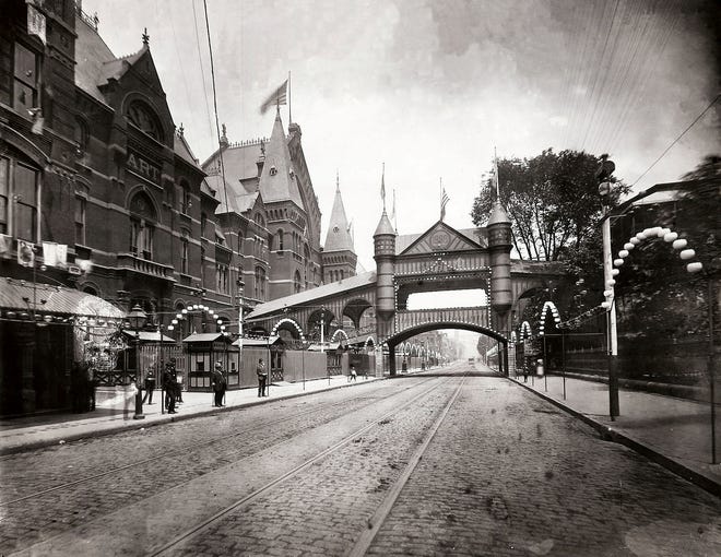 Music Hall was one of the exhibition buildings for the Centennial Exposition in Cincinnati in 1888. The temporary bridge over Elm Street connected Music Hall to the Washington Park Building.