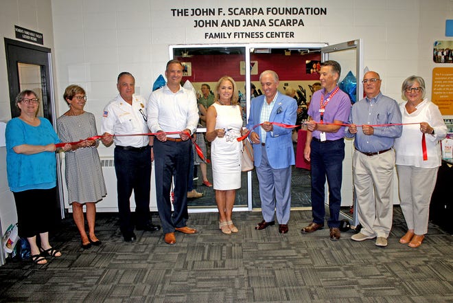 John and Jana Scarpa (center) were joined by Cumberland Cape Atlantic YMCA representatives on June 24 for a ribbon cutting during a dedication of the John and Jana Scarpa Family Fitness Center. YMCA Board 1st VP Kathy Farinaccio, Board first vice president, Ginger Chase, Board member, Lou Tramontana Jr., Board second vice president, Shayne Bevilaqua, Board president, the Scarpas, George Steinbronn Jr., chief executive officer, YMCA, Dave Schad, Board treasurer, and Donna Perez, Board secretary are pictured at the ceremony.