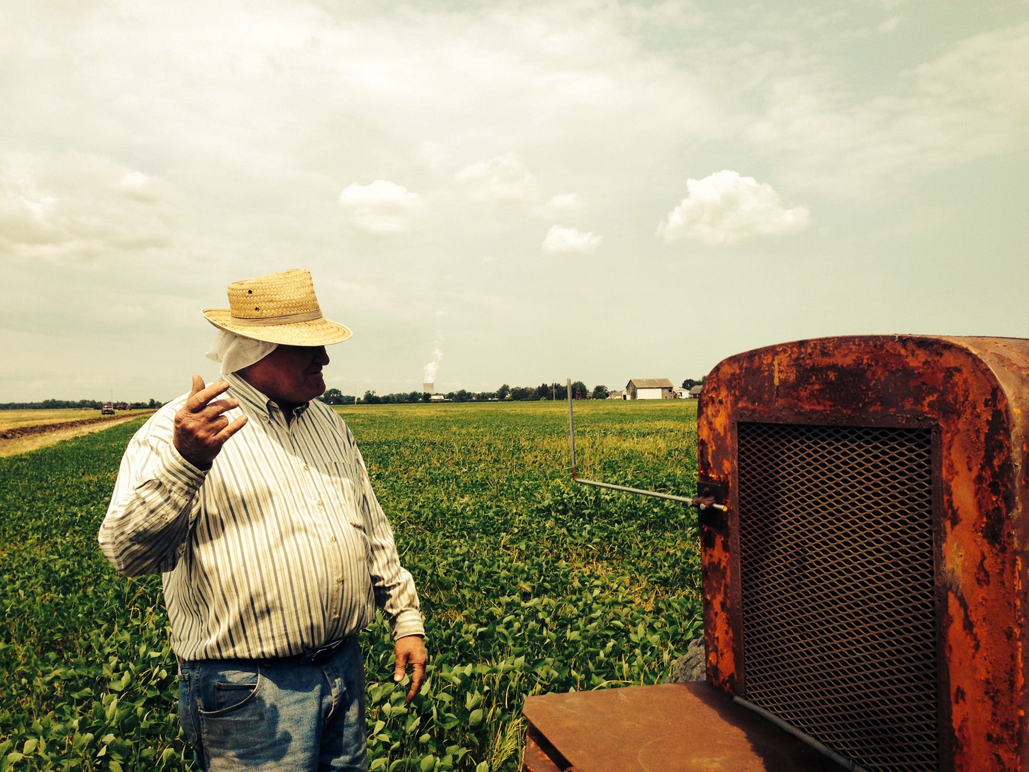 Richard Thorbahn, a retired school administrator and trustee for the Carroll Township Water and Sewer District east of Toledo, works in a field several miles south of Lake Erie using a 1950s-era tractor guided by lasers to install drain tiles.