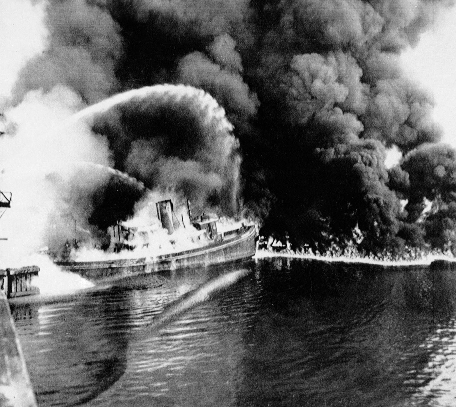 A boat battles flames on the Cuyahoga River near downtown Cleveland in June 1952. The industrially ravaged river burned regularly throughout the middle of the last century, but the fire that ignited in June 1969 after a spark dropped from a passing train became national news.