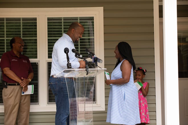 City and Habitat for Humanity leaders presented the key to new homeowner, Shalanda Sharpe, at a special ceremony on Monday, June 28.