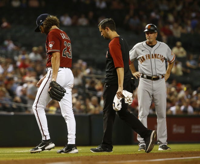 July 2, 2021; Phoenix, Arizona, USA; Diamondbacks' Zac Gallen (23) walks off the field after sustaining an injury against the Giants during a game at Chase Field. Patrick Breen-Arizona Republic