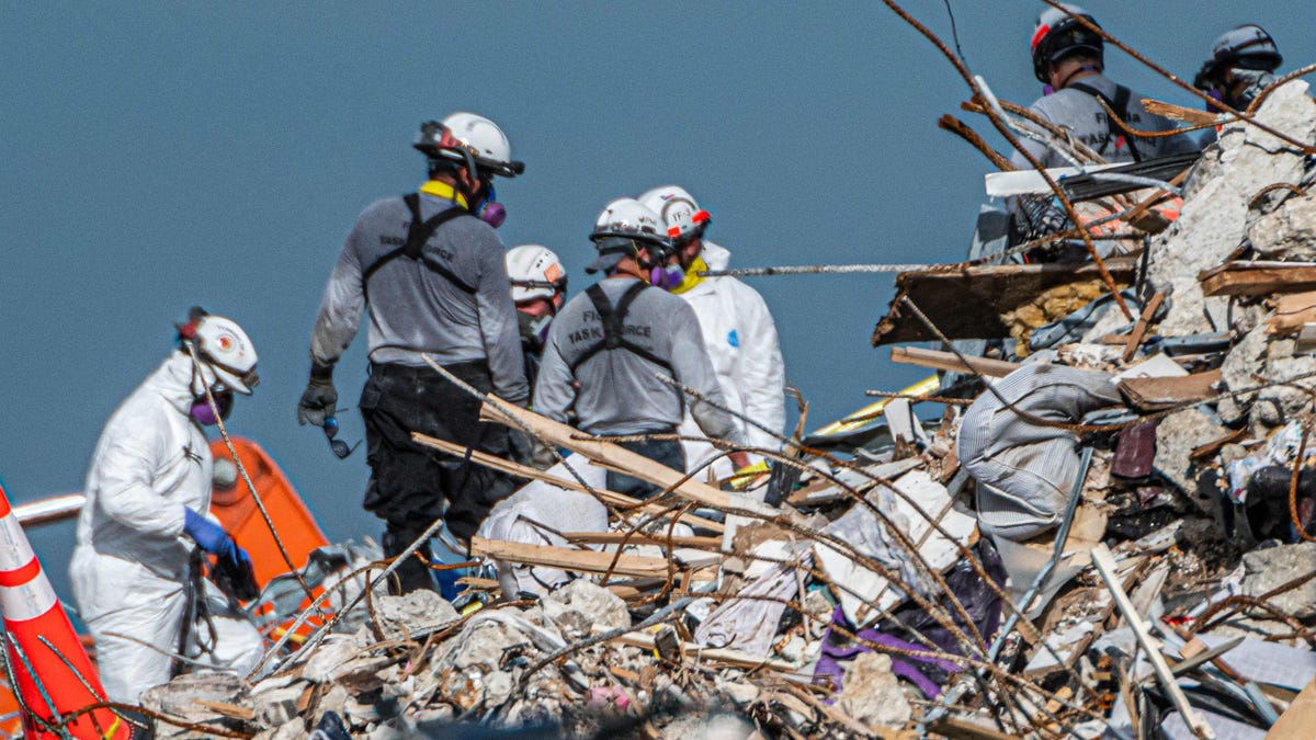 Search and rescue teams search the rubble of the partially collapsed 12-story Champlain Towers South condo building in Surfside, Florida, on July 2.