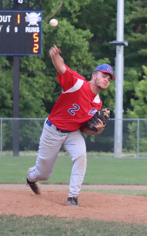 Caden Burga delivers a pitch for Cambridge Legion during Saturday's game in the Don Coss tournament.