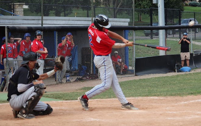 Caden Burga delivers a two-run double for Cambridge Legion during a Saturday game in the Don Coss tournament.