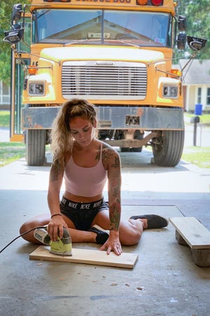 The Fort Bragg couple, Ginnie and Austin Miller, renovate an old school bus that they can board after their military service.