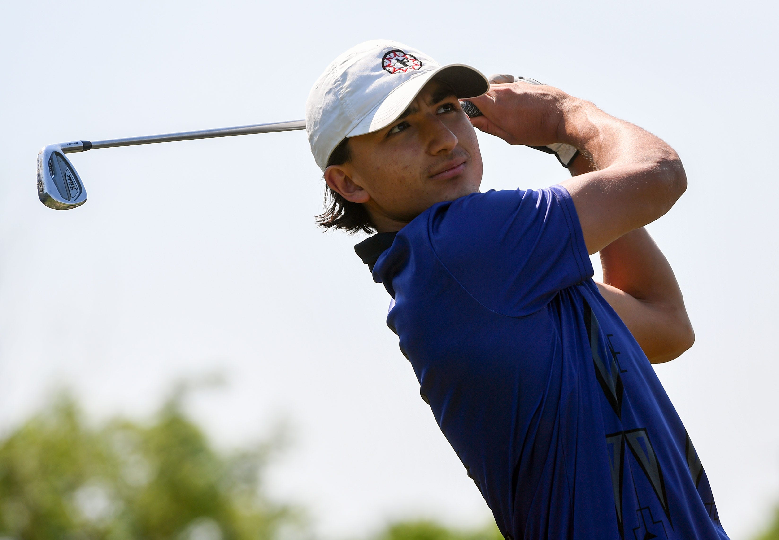 Lance Christensen Jr. practices on the makeshift driving range in his back yard on June 15, on the Pine Ridge Reservation.