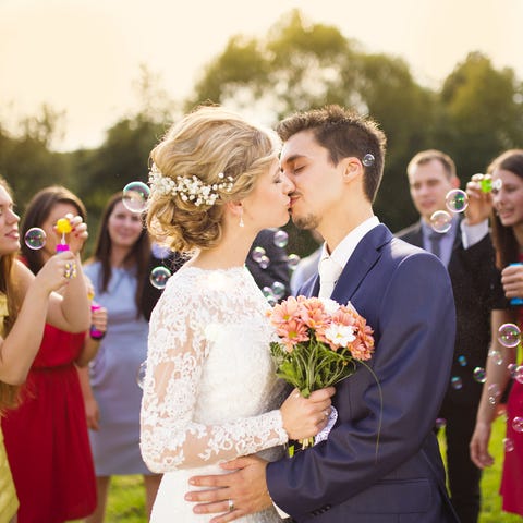 Young newlyweds kissing and enjoying romantic mome