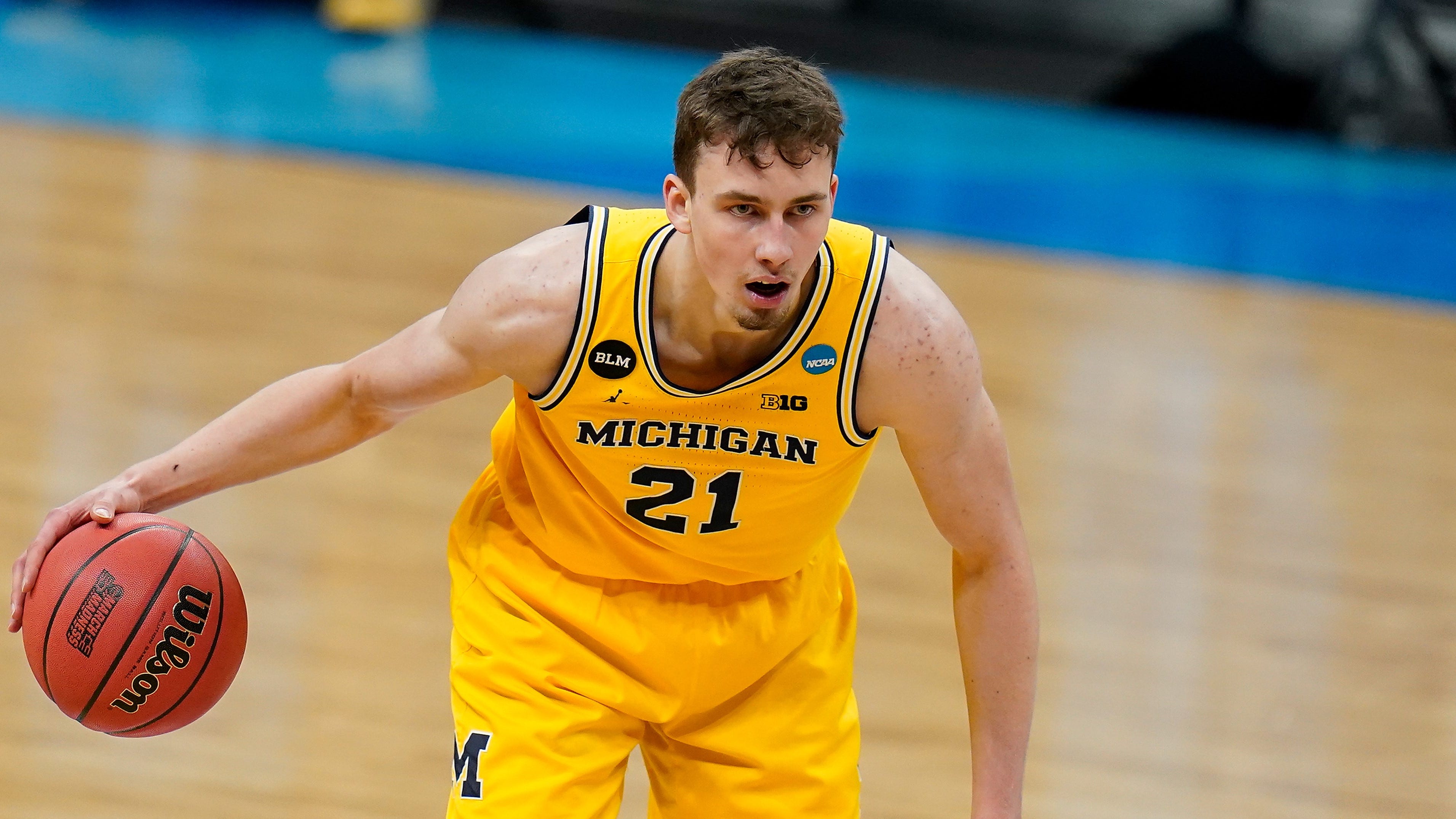 Michigan guard Franz Wagner dribbles up court during a Sweet 16 game against Florida State in the NCAA men's college basketball tournament at Bankers Life Fieldhouse, Sunday, March 28, 2021, in Indianapolis. (AP Photo/Jeff Roberson) ORG XMIT: NYOTK