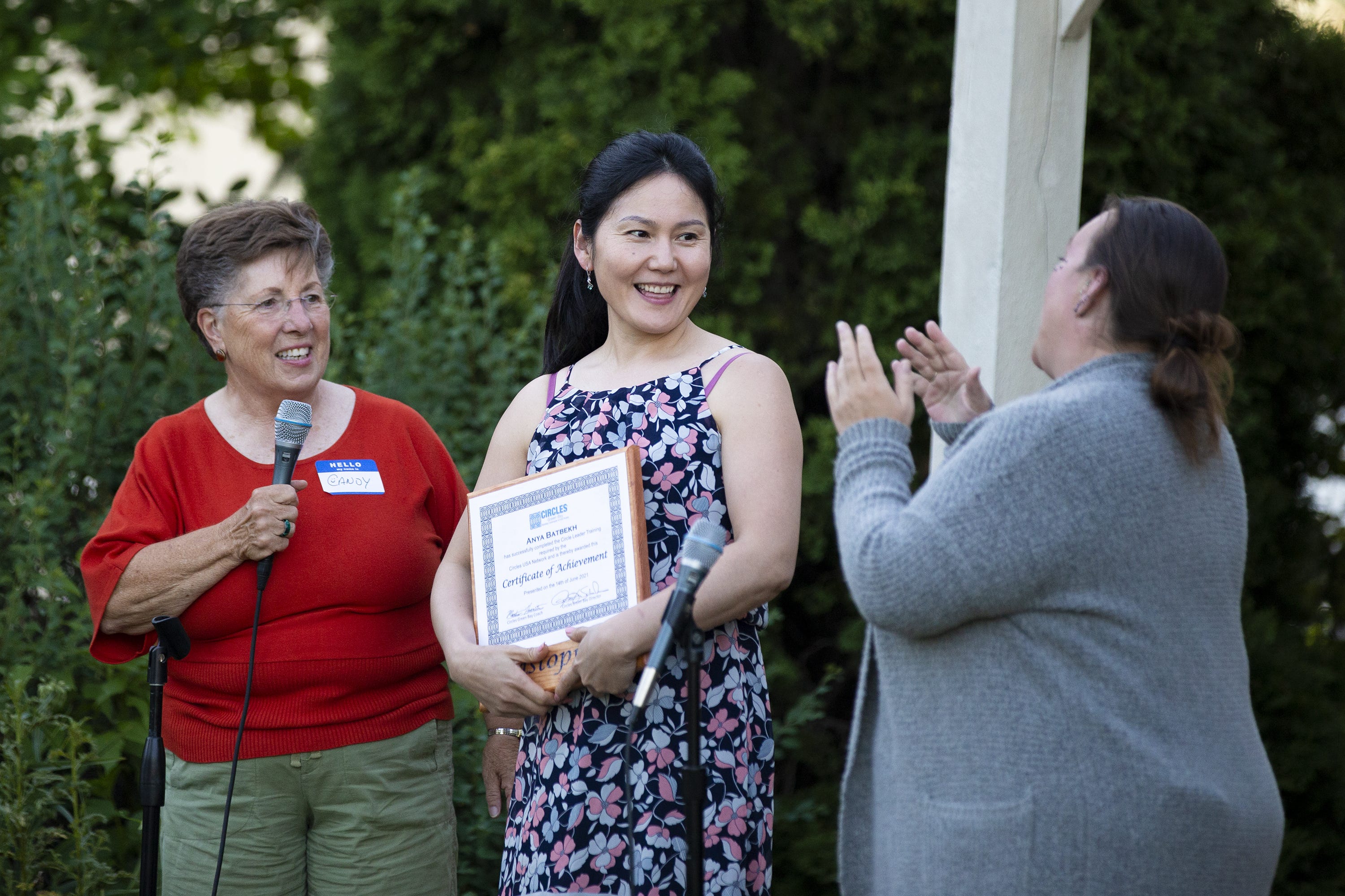 Anya Batbekh receives her certificate from Candy Conard, left, and Amber Edwards, right, during Circles Green Bay commencement ceremony, at Green Bay Community Church, Monday, June 14, 2021, Green Bay, Wis. Samantha Madar/USA TODAY NETWORK-Wisconsin