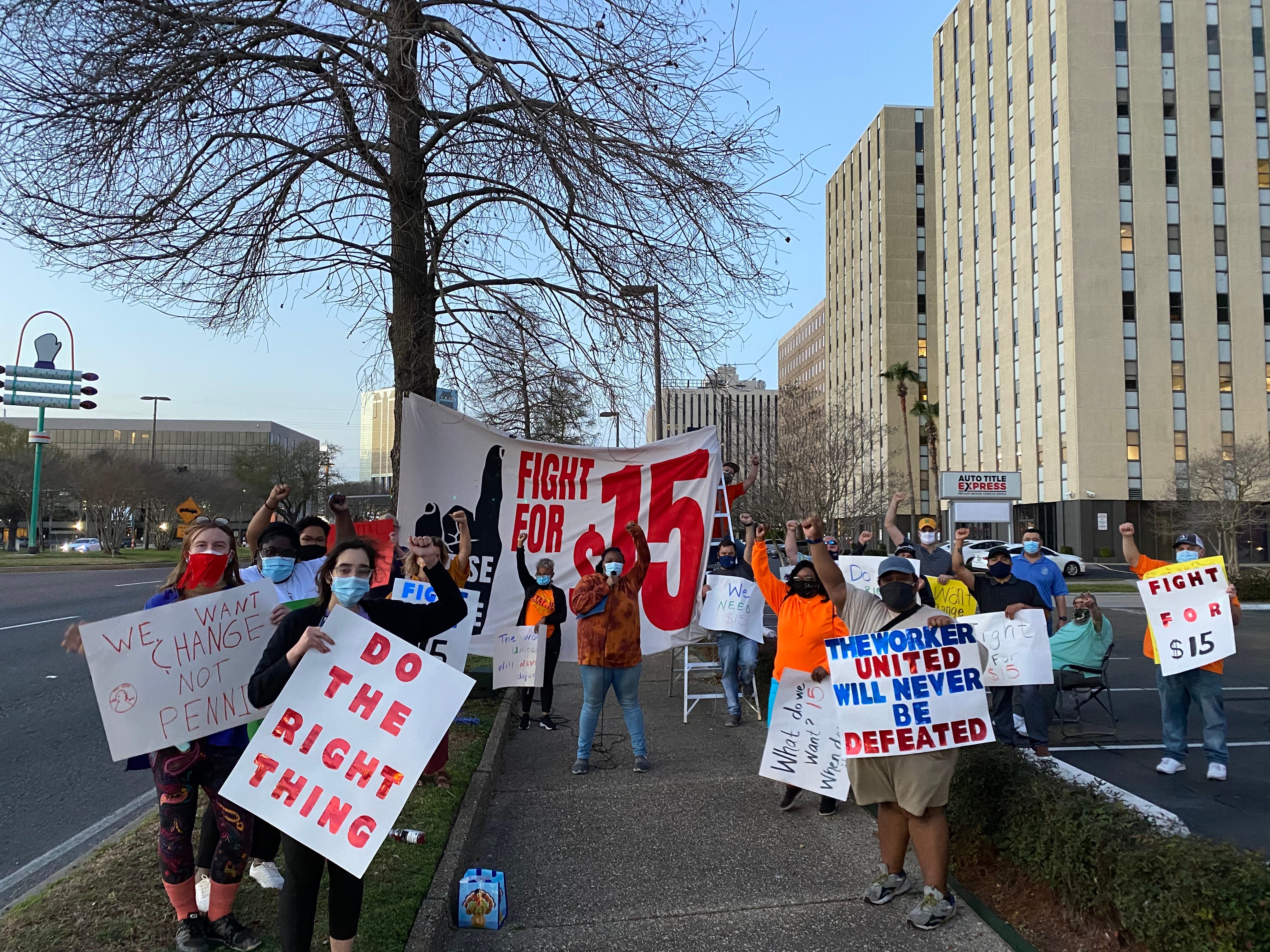 Step Up Louisiana members protest for a $15 minimum wage outside of Sen. Bill Cassidy's office in Metairie, LA in March 2021.