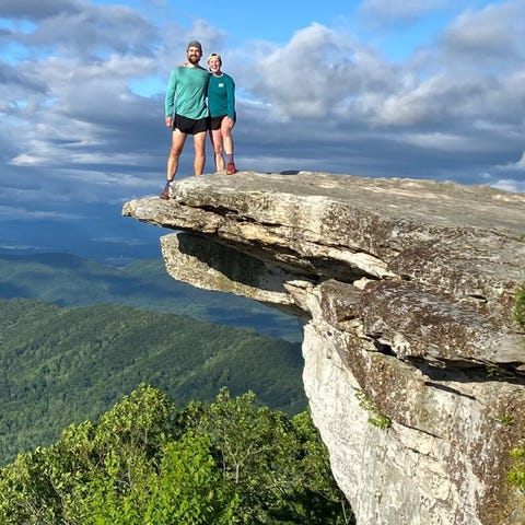 Kara and Nick Saur hang out on a cliff in southern