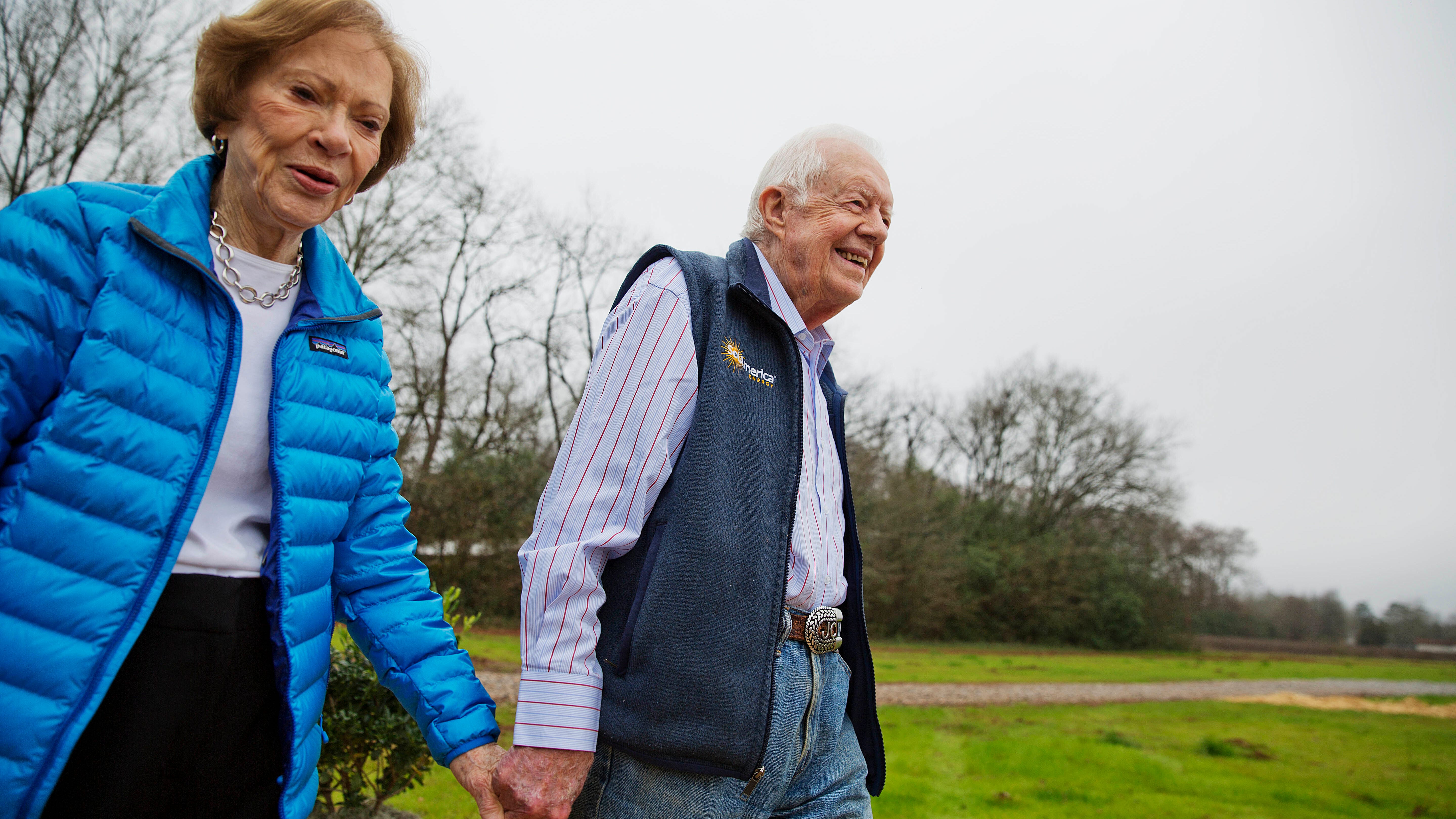 In this Feb. 8, 2017, file photo former President Jimmy Carter, right, and his wife Rosalynn arrive for a ribbon cutting ceremony for a solar panel project on farmland he owns in their hometown of Plains, Ga. Jimmy Carter and his wife Rosalynn celebrate their 75th anniversary this week on Thursday, July 7, 2021. 