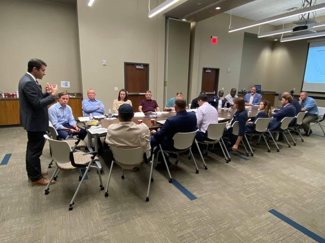 Garret Graves meets with local officials during a meeting.