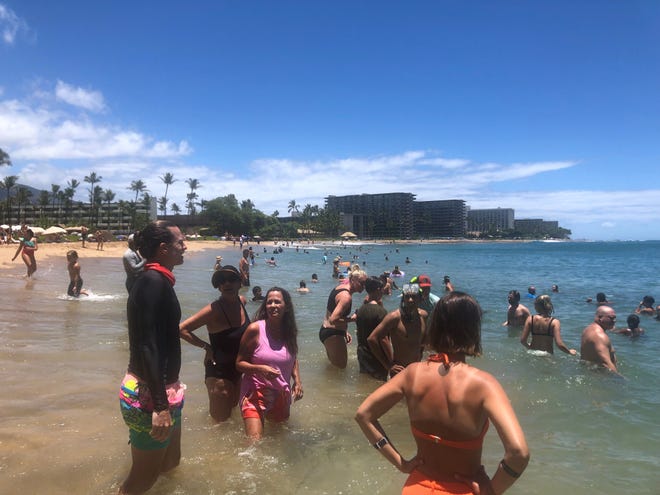 Kaanapali Beach, a popular tourist spot on the Hawaiian island of Maui, was busy on Monday, July 5. Maui tourism, which essentially shut down for 7 months during the coronavirus pandemic, is approaching pre-pandemic levels by some measures.