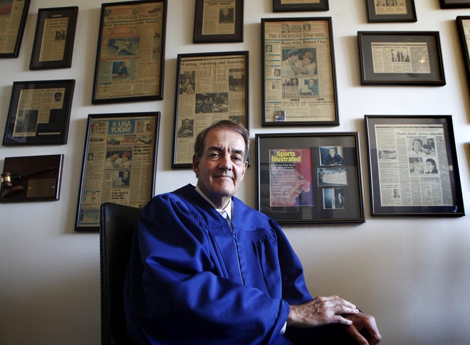 Judge Norbert Nadel photographed in his chambers in 2014, in front of a wall that displays magazine and newspaper articles, most of which concern his controversial decision regarding Cincinnati Reds player Pete Rose in June 1989, which halted MLB's meeting to oust the all-time hit king from the game. His decision was criticized nationally.