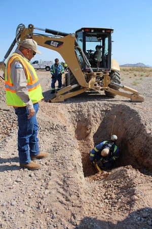 Las Cruces Utilities Technical Gas Service Supervisor & Interim Gas System Operation Supervisor Pete Duran watches an associate fix a pipe during regular training at the Las Cruces International Airport. Associates are regularly trained to stay on top of best practices and emergencies.