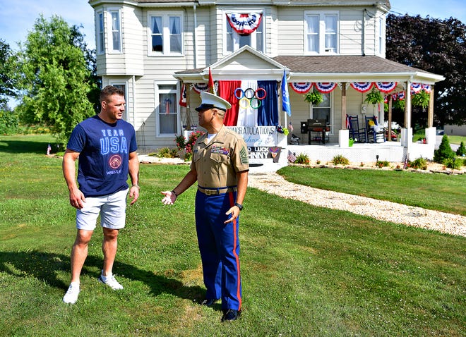 Team USA Olympic athlete and U.S. Marine Corps SSgt. John Stefanowicz, left, of Marine Corps Base Camp Lejeune in Jacksonville, N.C., talks with Sgt. Maj. Adrian Lopez before community members celebrate Stefanowicz during their Hometown Olympic Sendoff parade beginning near Stefanowicz's parents' home in Hopewell Township, Saturday, July 10, 2021. Dawn J. Sagert photo