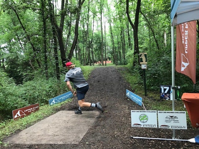 Gavin Babcock of Altoona, IA took 49th place in the 2021 PDGA Pro World Championship, June 26. Here, he nears the end of his run-up before the throw on the 17th hole at Pickard Park, Indianola on July 10, 2021. Babcock was competing in the Disc Golf Pro Tour on the second of the three-day competition.