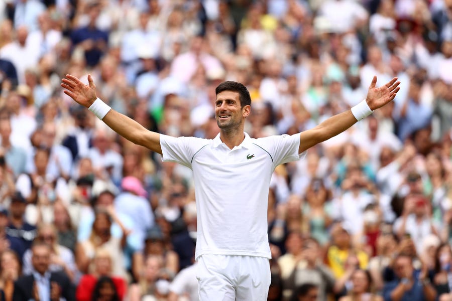 Novak Djokovic celebrates winning Wimbledon.