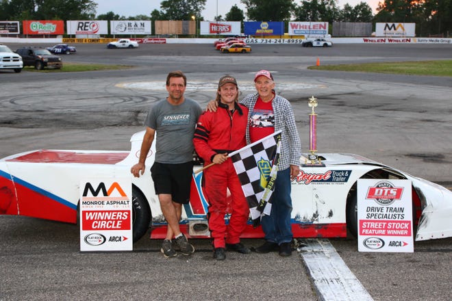 Max Fair of Milan celebrates his win at Flat Rock Speedway with his father Harold Fair Jr. (left) and grandfather Harold Fair Sr. Four generations of the family have raced at the track.