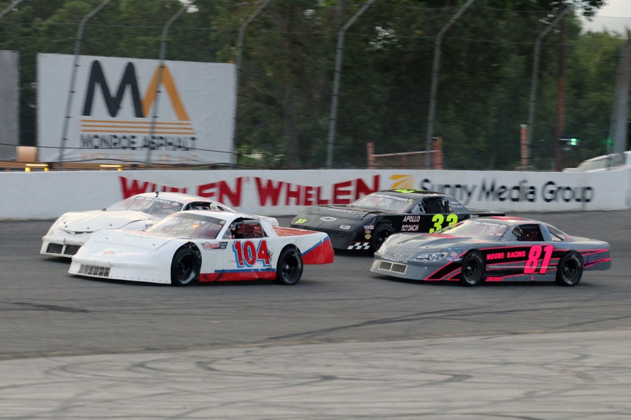 Max Fair of Milan (104) leads the pack during a Street Stocks A Main feature race at Flat Rock Speedway Saturday night.