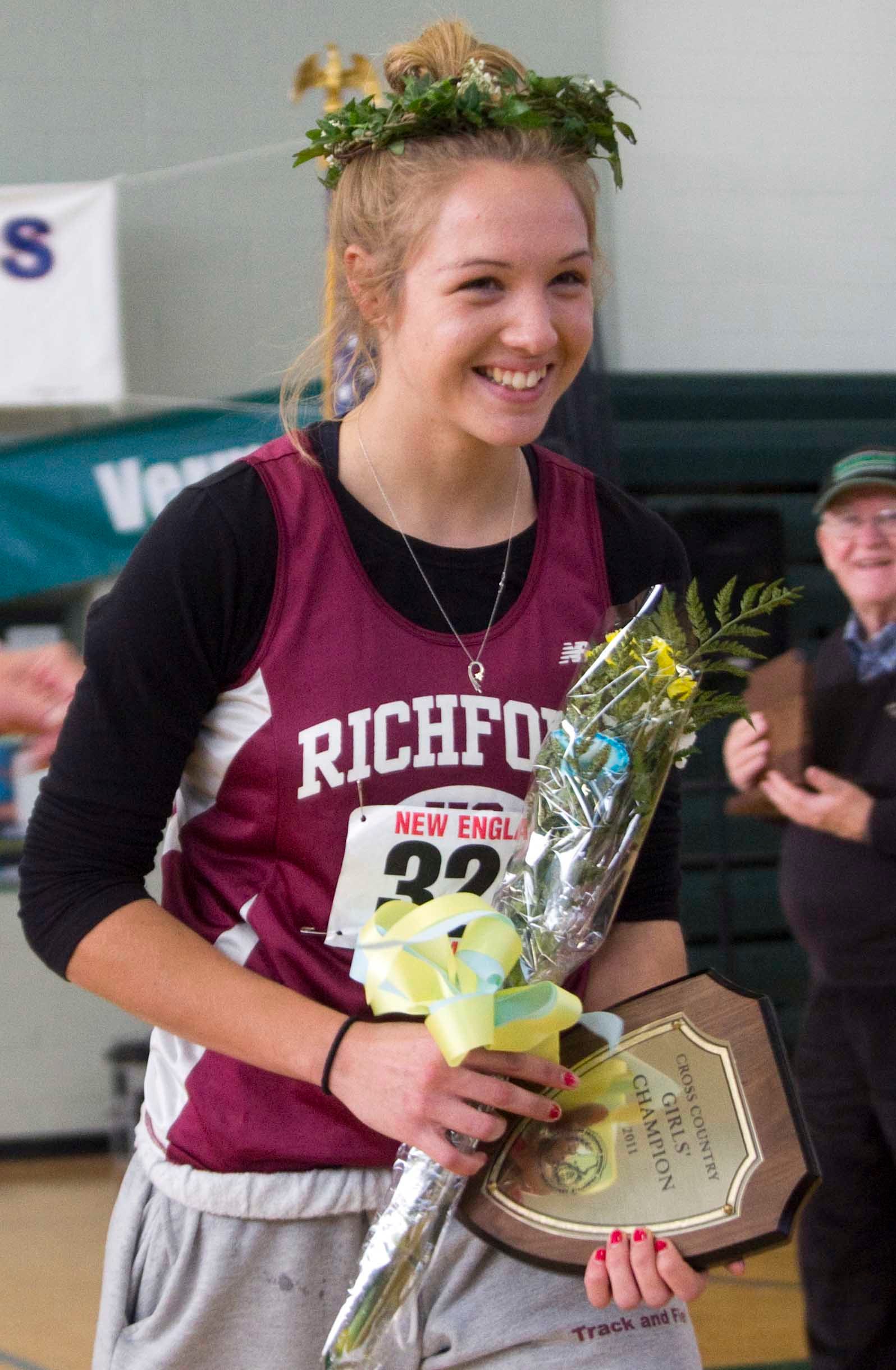 Elle Purrier St. Pierre is honored after winning the 2011 New England XC title.