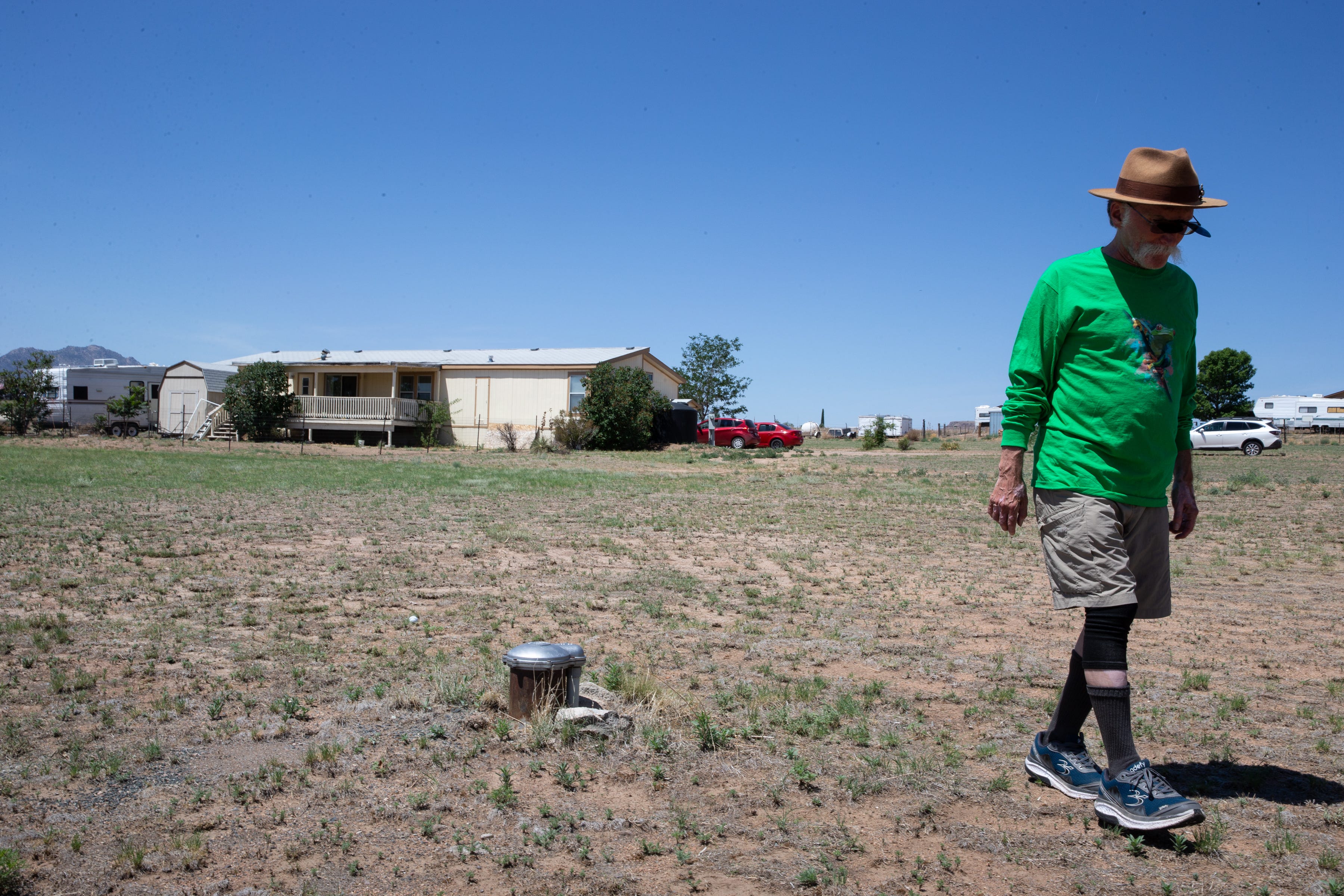 Stan Bindell walks past his water well, July 8, 2021, Chino Valley, Arizona. Bindell’s well went dry in 2013.