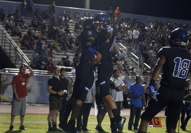 Chandler's Eli Sanders (6) celebrates his touchdown against Perry with teammate Nason Coleman during their game in Chandler, Friday, Oct. 04, 2019.