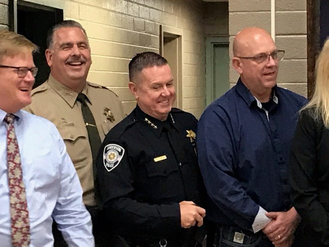 Then Shasta County Sheriff Eric Magrini, second from left, after speaking at a press conference in 2020. Anderson Police Chief Michael L. Johnson is third from left.