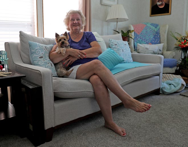 Joyce Horney sits with her dog Brie Friday, July 9, 2021, in her home at Donovan Smith Mobile Home Park in Lewes, Delaware.
