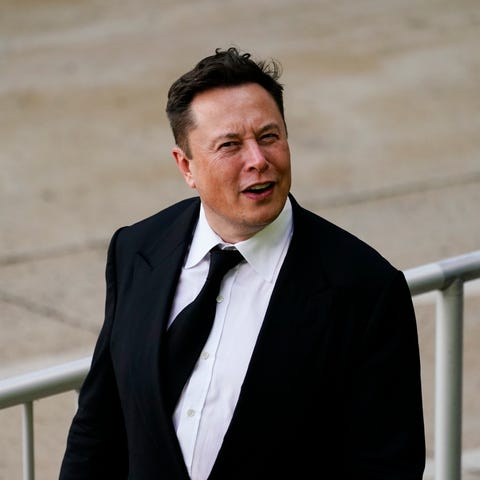 Elon Musk walks from the justice center in Wilming