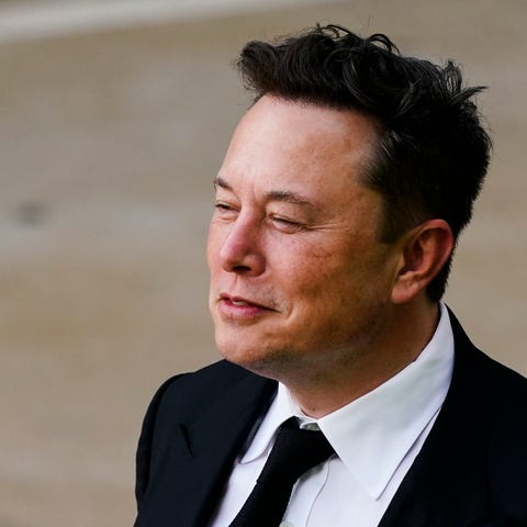 Elon Musk walks from the justice center in Wilming