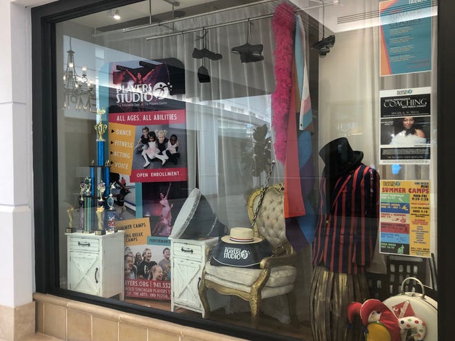 A display window at the temporary new home for the Players Centre for Performing Arts in a former retail store at the Crossings at Siesta Key.