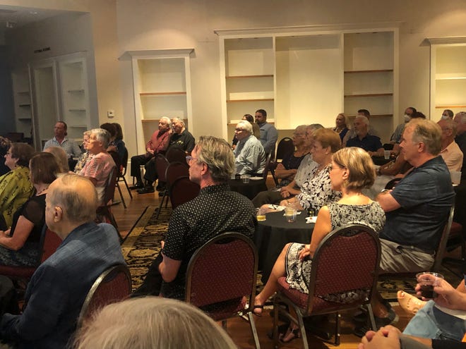 Racks and shelves once used for clothing displays line the walls of the temporary home of the Players Centre for Performing Arts in a former Banana Republic store.
