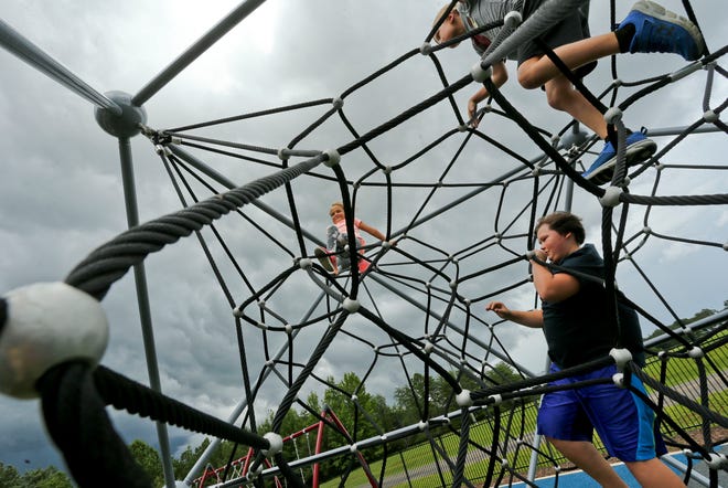 The Tuscaloosa City Council approved a $1.496 million in infrastructure and road network upgrades at Sokol Park North. Samantha James, left, Nathan James, top right, and Gatior Smith play Tuesday, July 13, 2021 in Mason's Place, the all inclusive playground at Sokol Park. [Staff Photo/Gary Cosby Jr.]